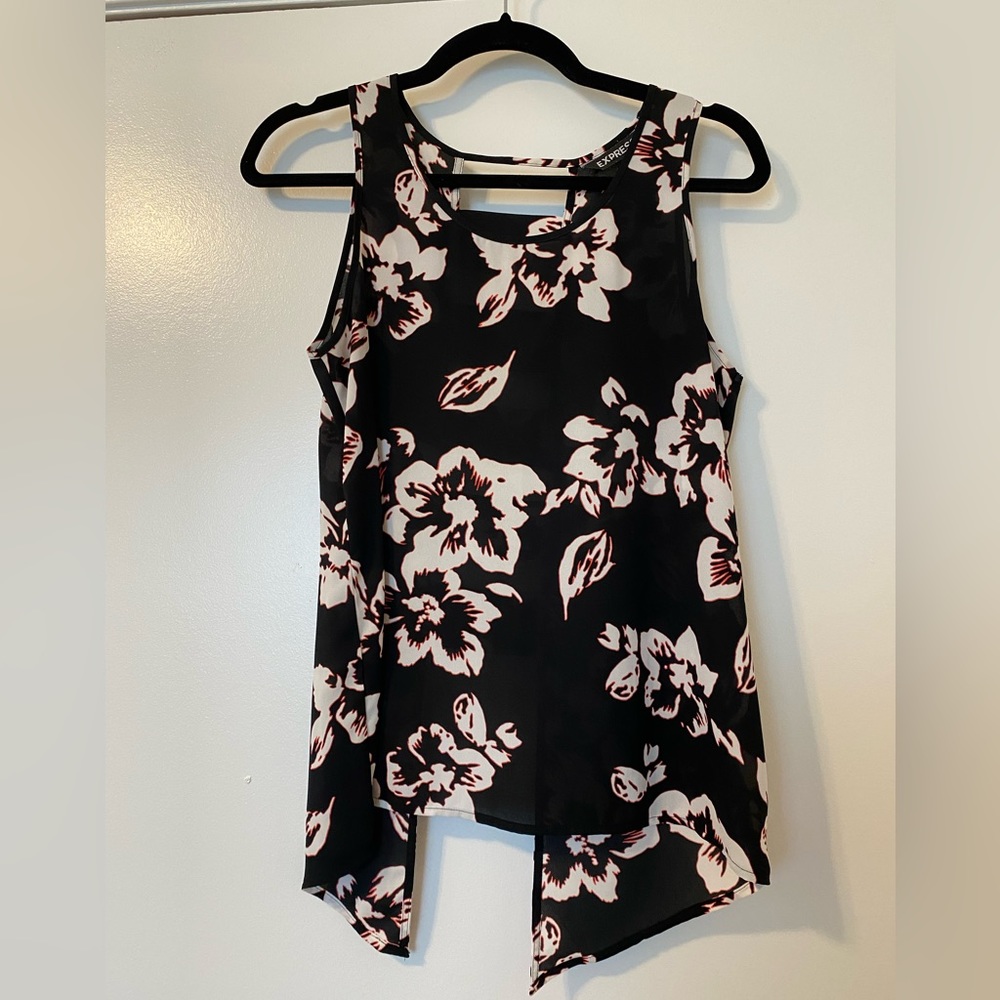 Express black top with white and pink flower print, open back ladder detail